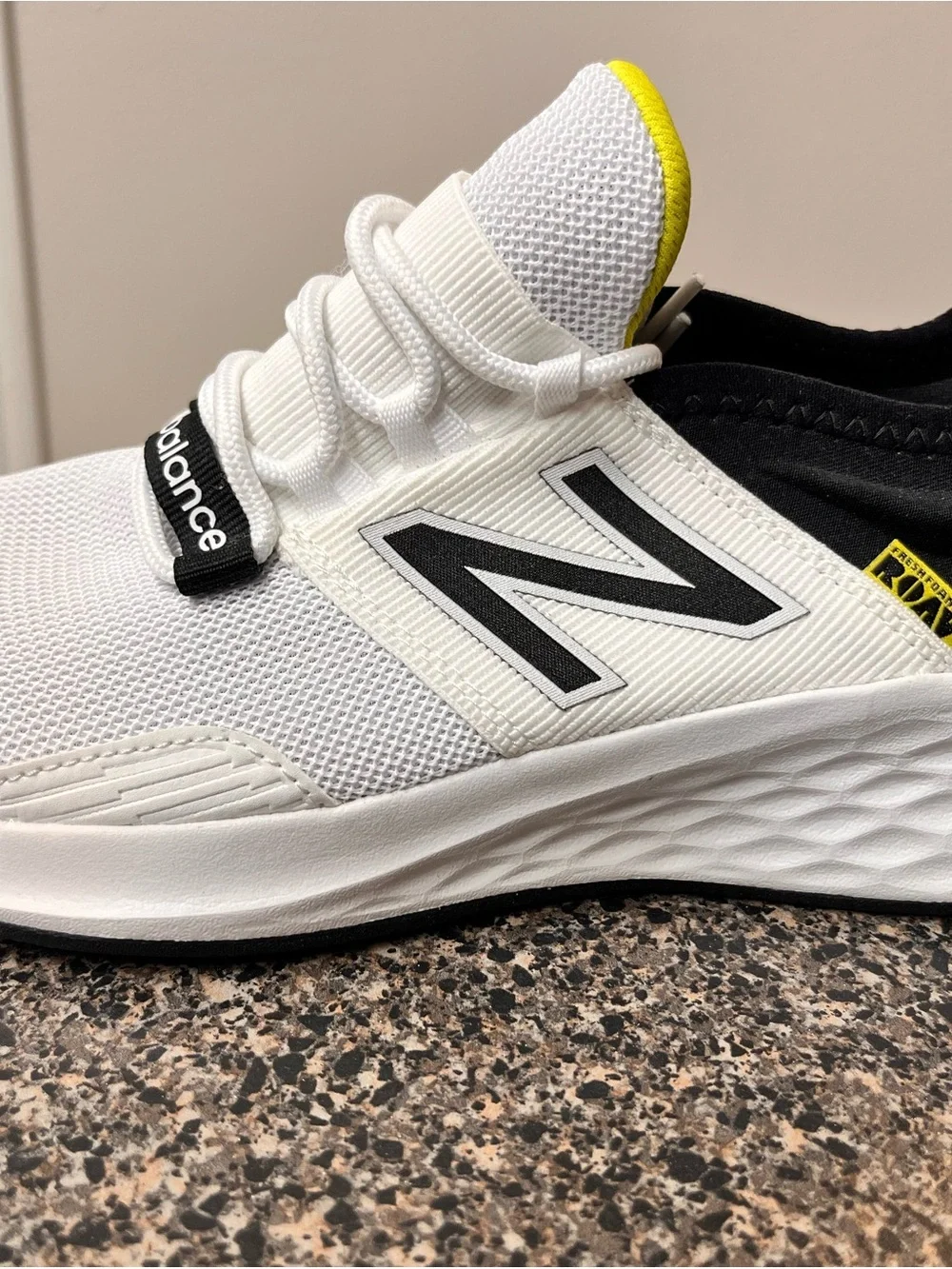 New Balance White Black Athletic Running Shoes with Yellow Accent
